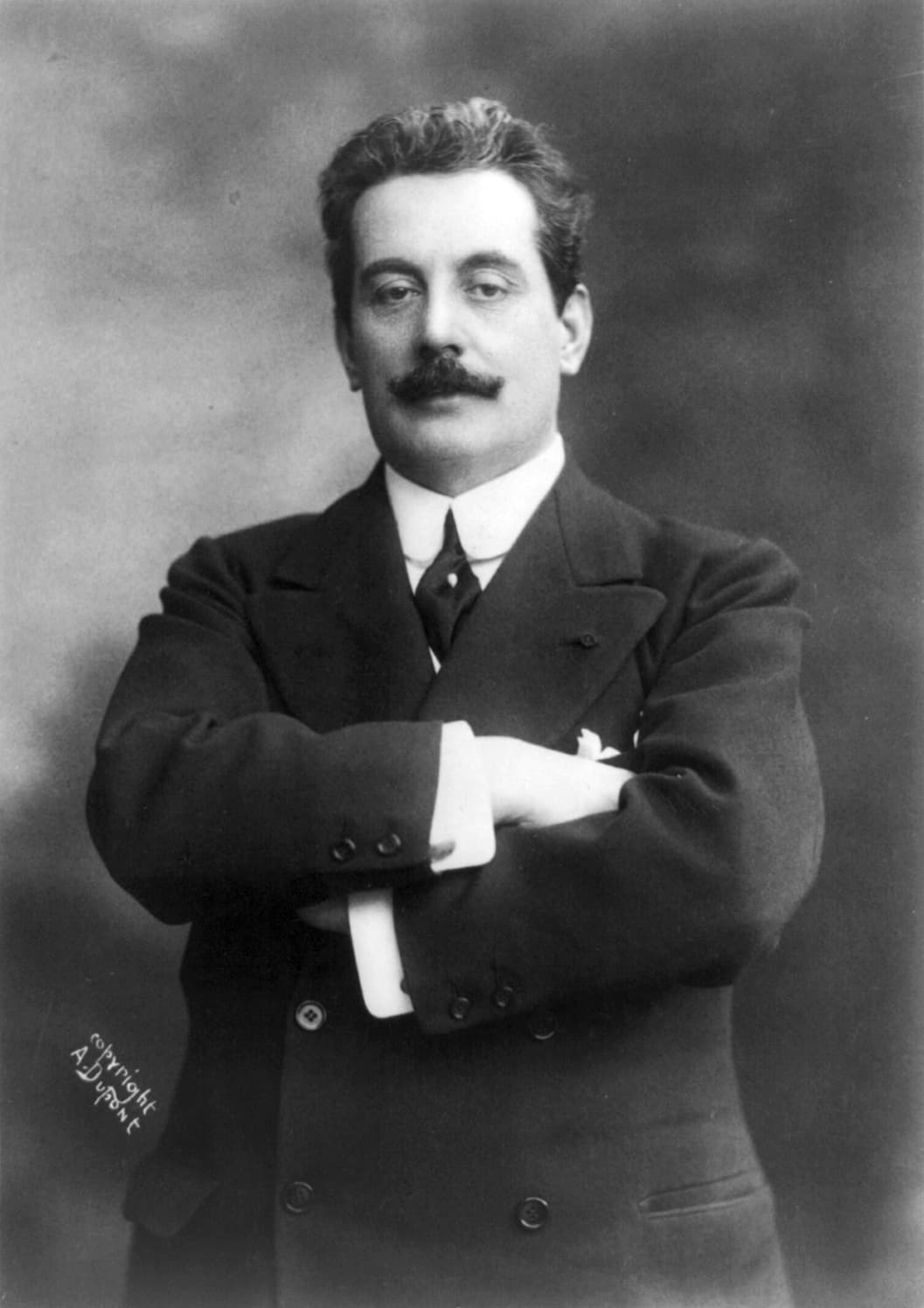 Black and white portrait of the composer Giacomo Puccini
